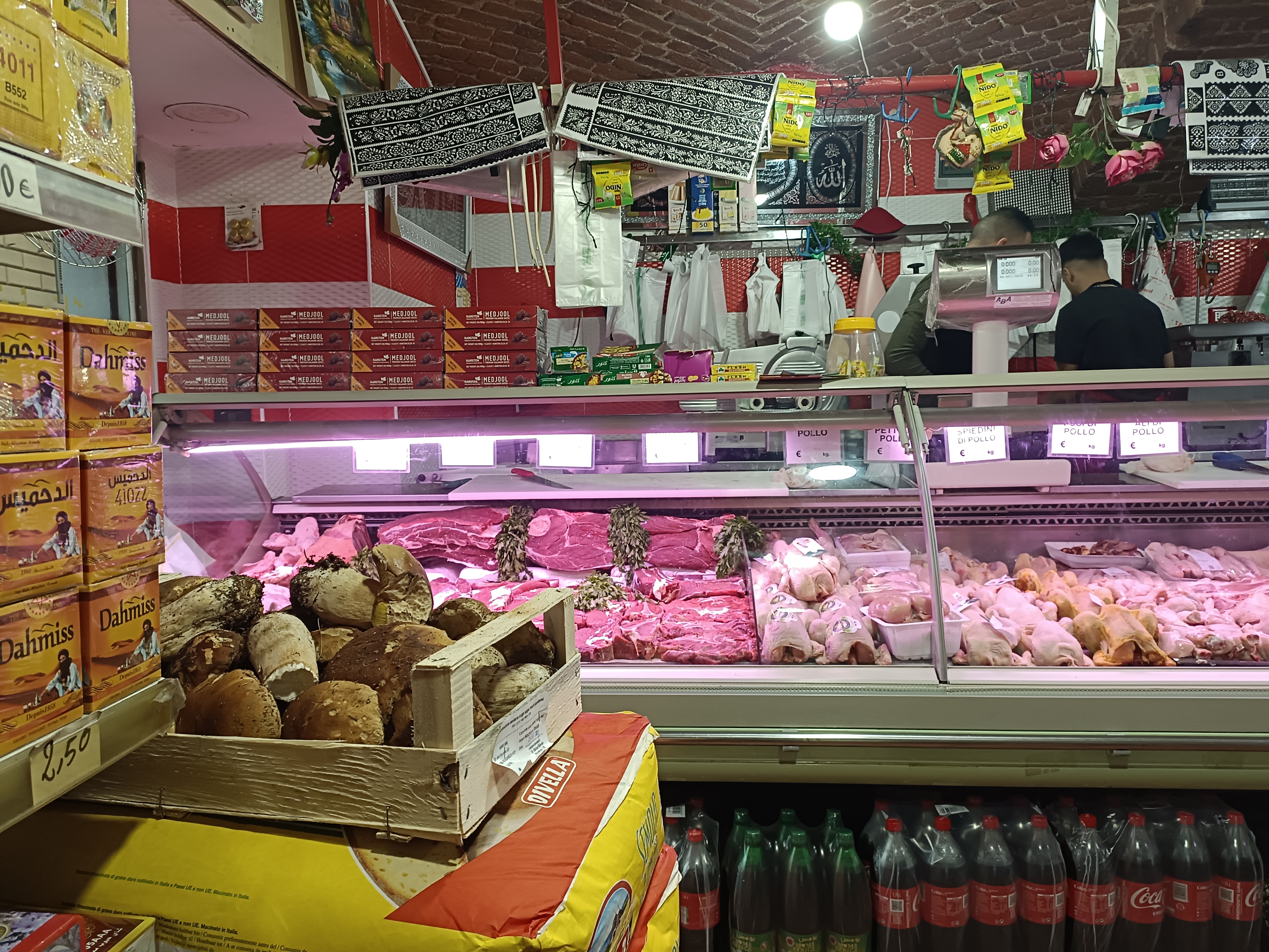 Decorated butcher’s counter and a crate of porcini mushrooms